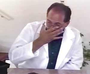 Physician accurately inspects the labia of his patient with his massager